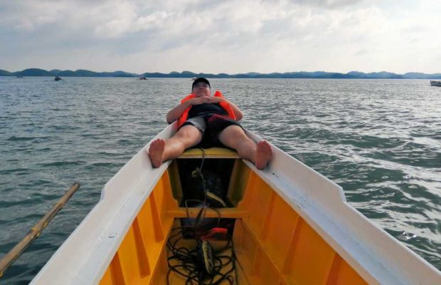man-relaxing-in-boatfront